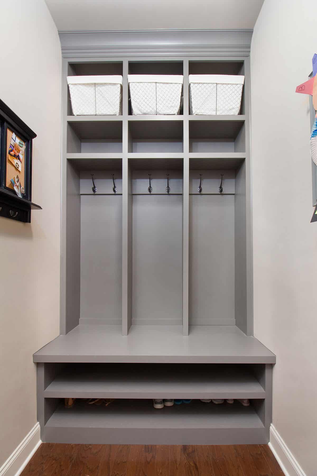 Mudroom Custom mudroom design by CC Faux Finishes featuring built-in storage cabinets, bench seating, and elegant wood finishes.