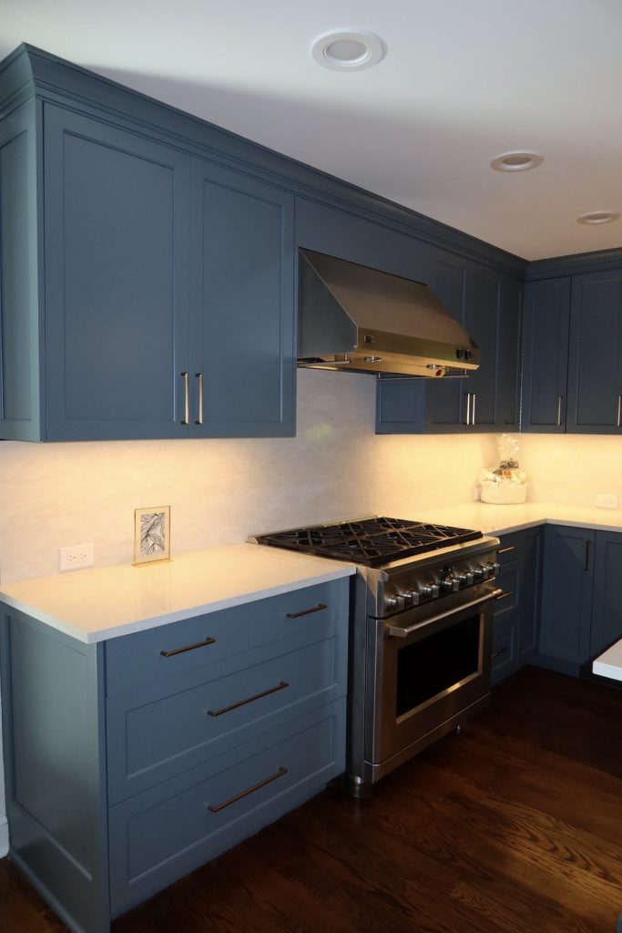 photo centered of Deep Blue Kitchen cabinets and kitchen range