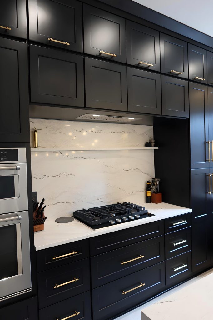 range wall with overhead black cabinetry and immersed quartz
