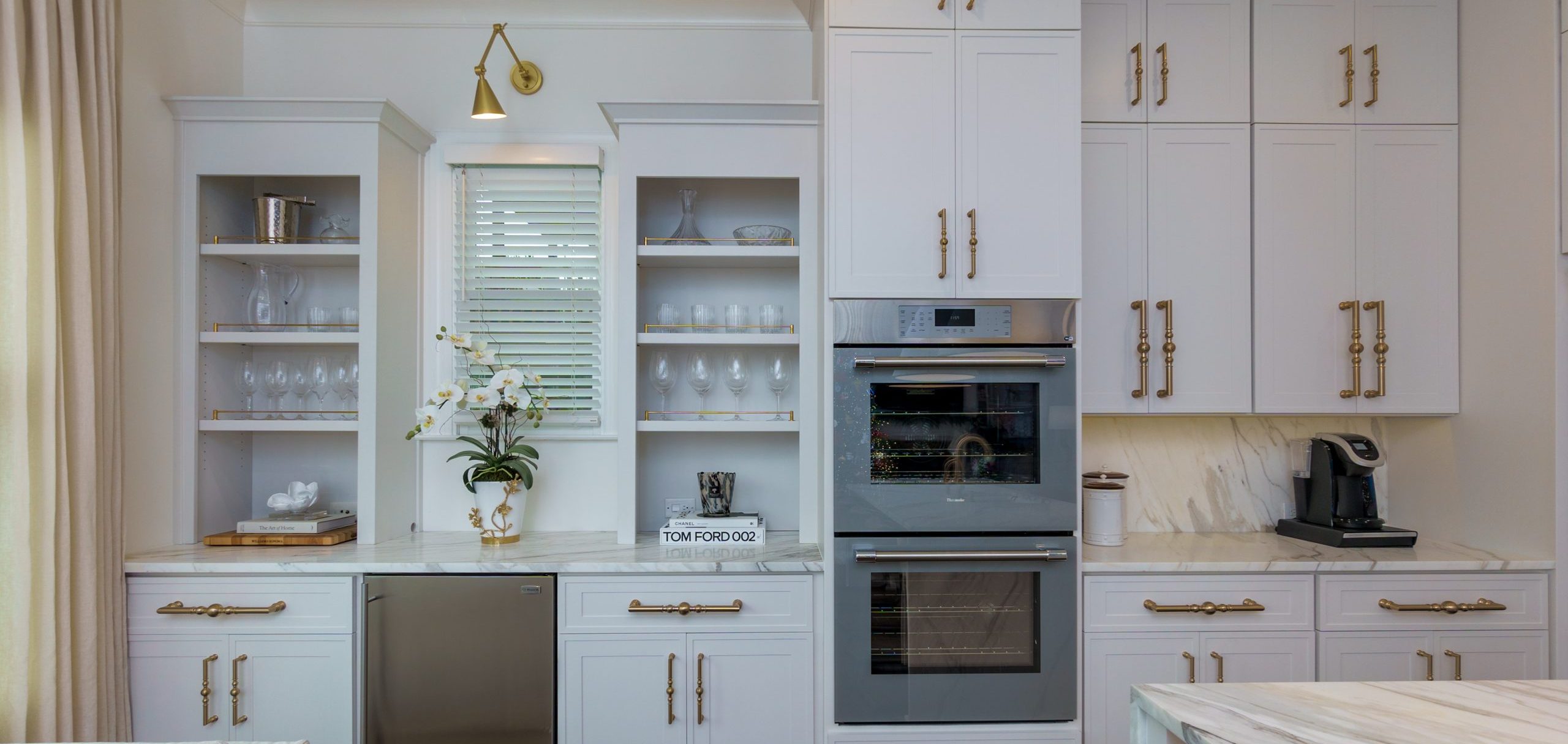 white refinished cabinets with gold hardware
