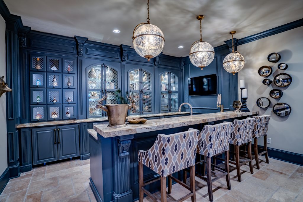 blue basement bar with glass doors