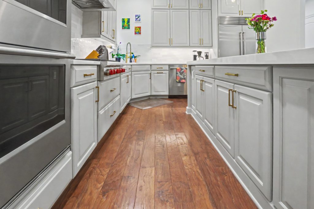 Modern white kitchen with white cabinetry and white countertop