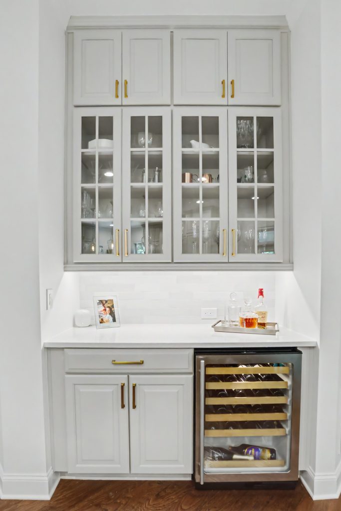 Modern white beverage station with wine cooler