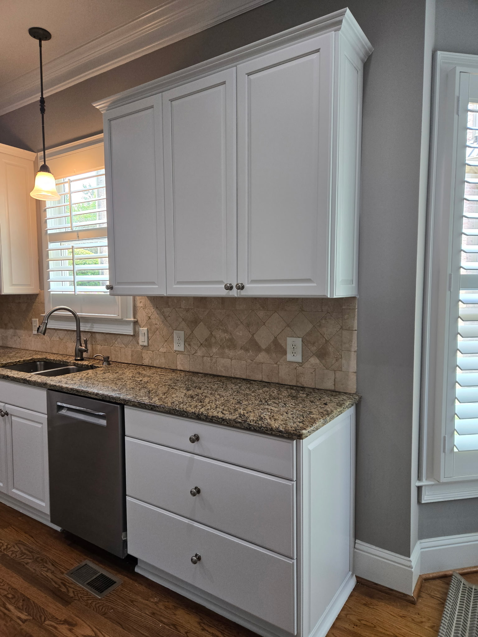 Refinished kitchen with white cabinets Refinished kitchen with white cabinets