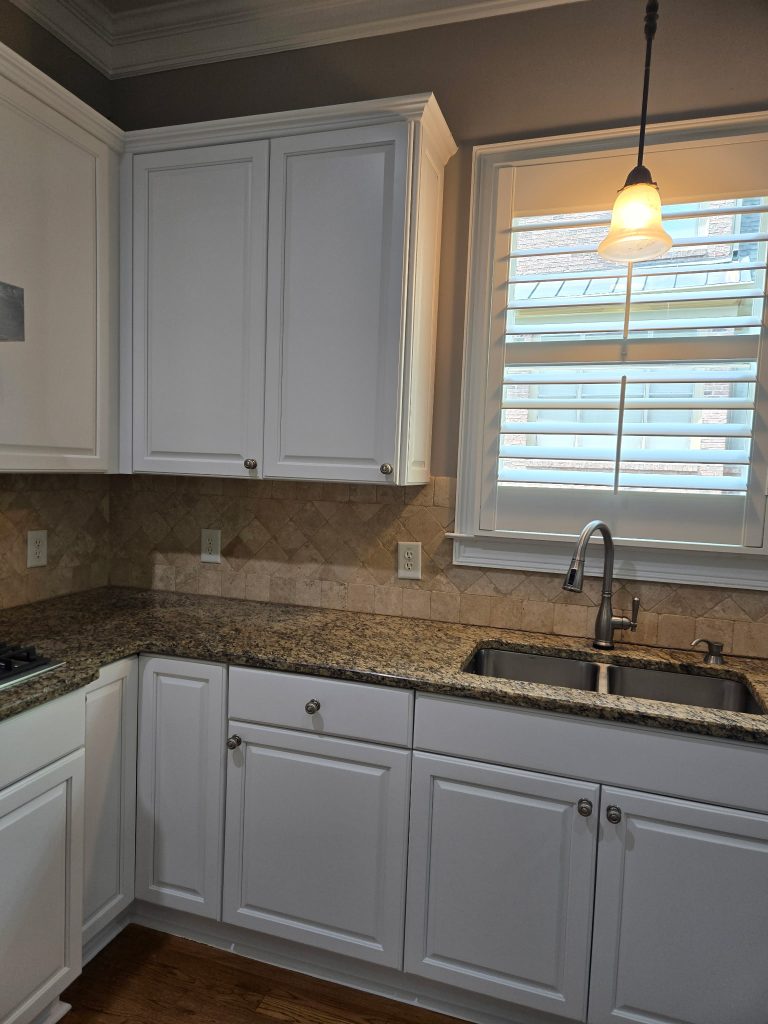 Refinished kitchen with white cabinets