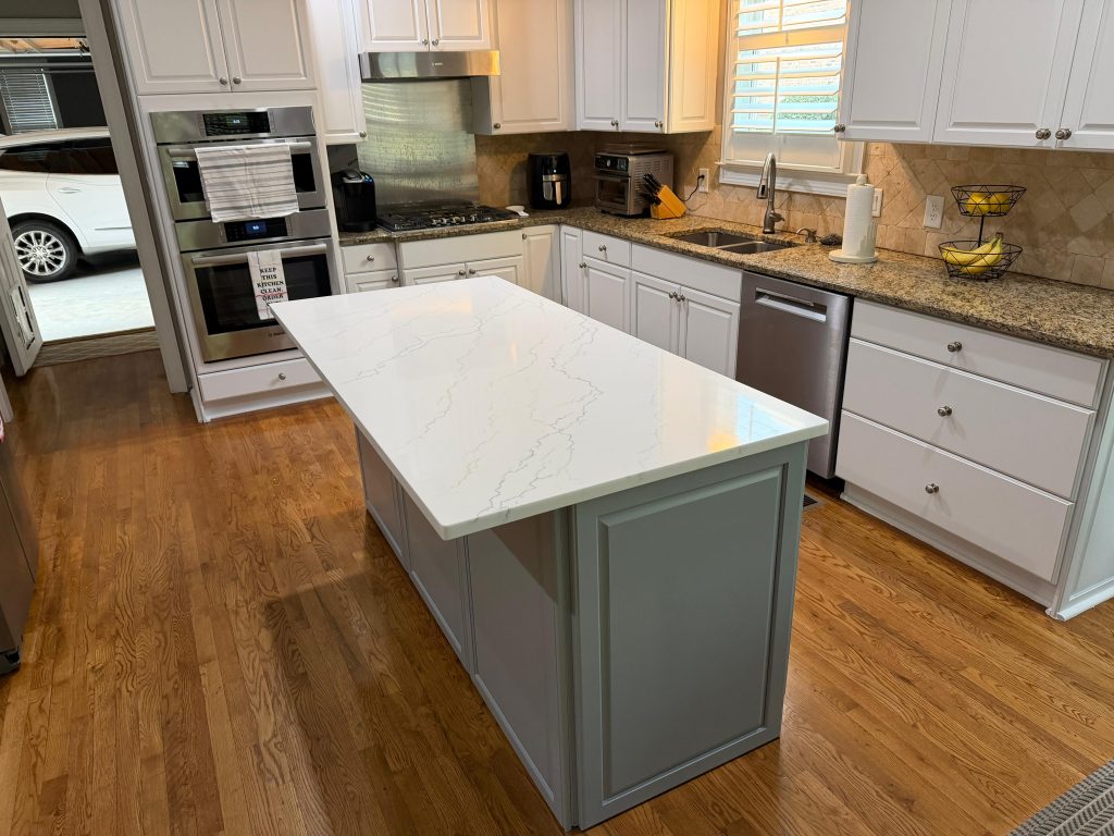 emodeled blue island with white quartz countertop.